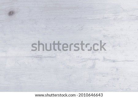 Top view of a wooden old table background, White wood for background, Old vintage cracked rustic white wood texture. Background and surface for design ideas. Top view. Natural wooden board.