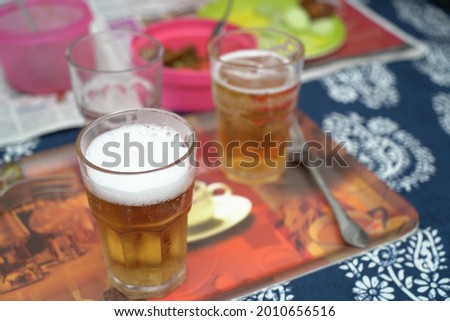 A closeup shot of glasses of beer on a table