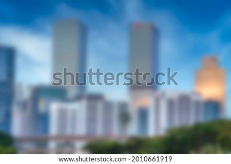 Blurred abstract background of city with rooftop view of sky bright light city landscape with bright sunlight and bokeh.