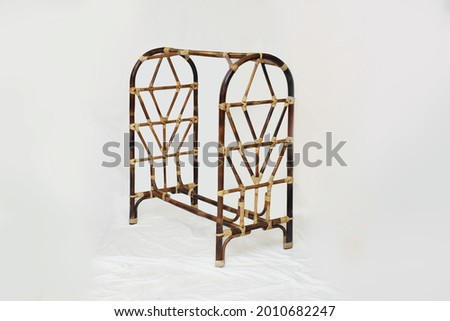 rattan cane kids clothes rack with white background and  selective  focus