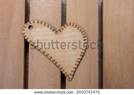 A closeup shot of a wooden heart-shaped toy
