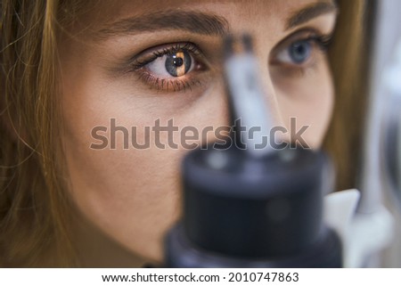 Young woman having eye examining in clinic Royalty-Free Stock Photo #2010747863