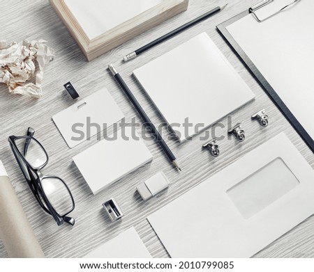 Photo of blank stationery set on light wooden background. Business brand template. Branding mock up.