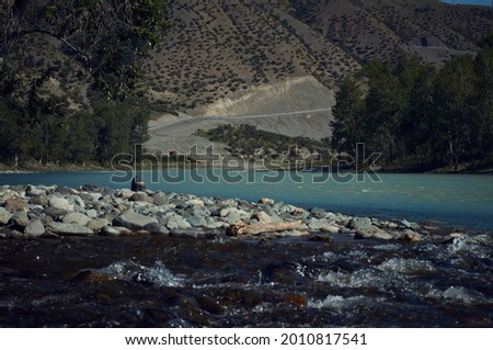                    view of the mountain river with blue water and mountains.            