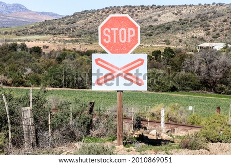 Stop sign at an unguarded railway crossing