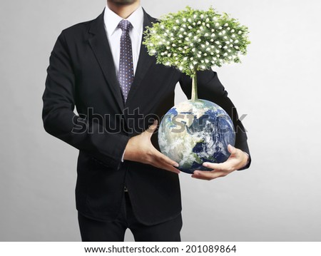 holding a glowing earth (NASA) globe in his hand. Extremely detailed image including elements furnished by NASA 