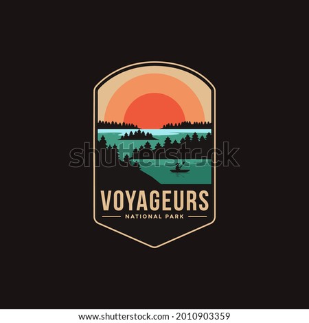 Emblem sticker patch logo illustration of Voyageurs National Park on dark background, lake and canoe vector badge Royalty-Free Stock Photo #2010903359