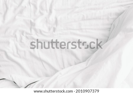 White background top view of blanket on the bed. Royalty-Free Stock Photo #2010907379