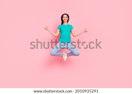 Full size photo of young woman happy smile jump meditate om yoga zen isolated over pastel color background