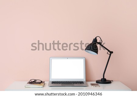 Modern laptop at workplace in office
