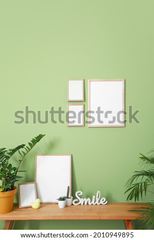 Interior of room with blank picture frames