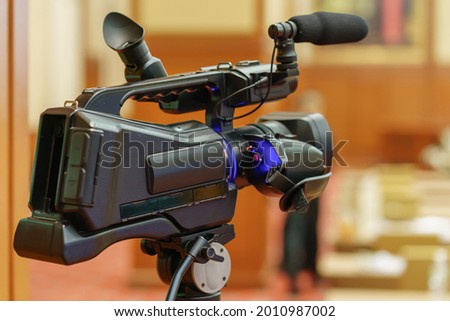video camera in business conference room recording participants and speaker, seminar meeting, event and seminar concept.