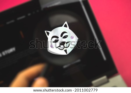 Anon Inu crypto symbol and logo close-up, cyber crypto finance and business concept photo