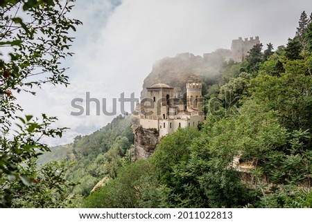 Erice,Sicily,Italy.Historic town on the top of mountains overlooking beautiful lush countryside.View of Venus Castle,Castello di Venere, in clouds.Breathtaking panorama.Misty landscape copy space Royalty-Free Stock Photo #2011022813