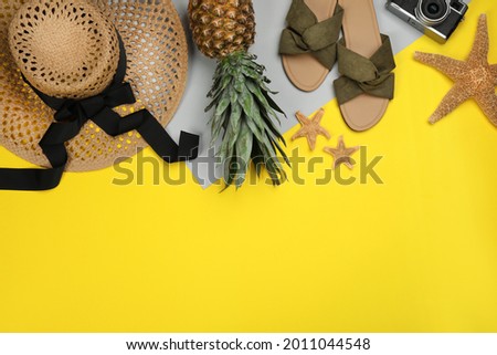 Flat lay composition with beach objects on color background, space for text