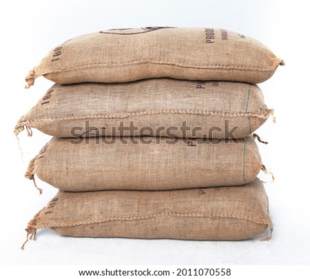 Pile of burlap sacks isolated  Royalty-Free Stock Photo #2011070558
