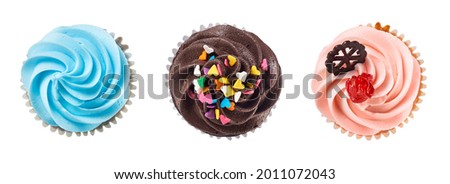 Top view of chocolate and vanila cream cupcakes isolated on white with clipping path Royalty-Free Stock Photo #2011072043