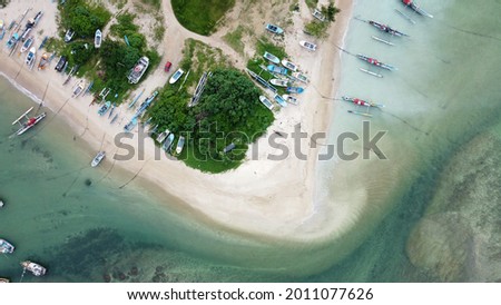 Bird eye view with fishing boats, Beautiful Sea scape. Aerial view of fishing village. Photo made by drone from above. Asian Landscapes. aerial drone shot of fishing boats in sea.