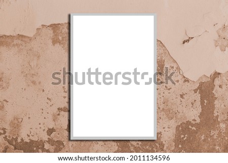 Empty white photo frame on an old brown cement wall