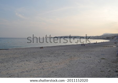 Summer evening view of the beach in Menton, on the French Riviera. Menton is a city in the South of France, close to the border with Italy. Royalty-Free Stock Photo #2011152020