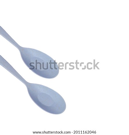 Two spoon are gray on a white background