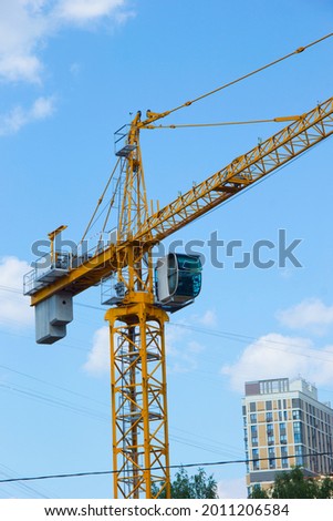 Lifting crane. Crane work on the construction site.