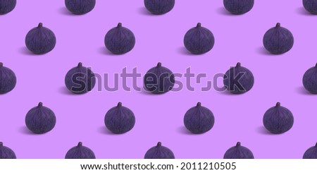 Figs seamless pattern on a purple background. Fruit texture for the design. Abstract summer background.