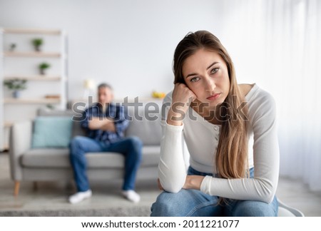 Relationship crisis. Mature woman feeling upset after fight with her husband at home, copy space. Middle aged married couple ignoring each other after quarrel, thinking about divorce or breakup Royalty-Free Stock Photo #2011221077