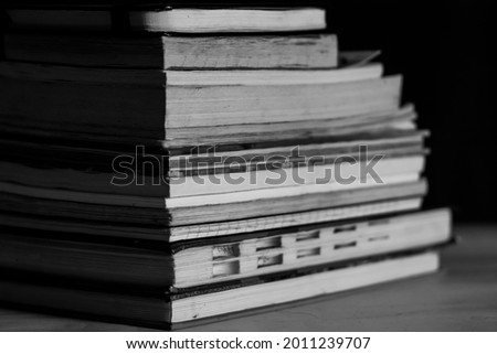 closeup of books arranged one upon the another