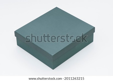 Green box and cover on the white background.