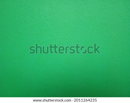 Smooth surface, green plaster wall