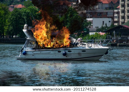 The yacht was engulfed in flames. Fire on board the ship Royalty-Free Stock Photo #2011274528