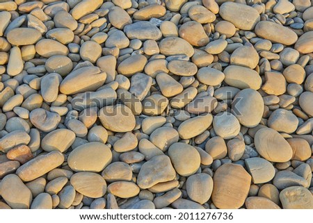 stones worn out by water on the seashore 
