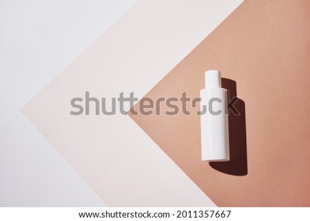 Natural cosmetics mock up. Beauty product concept. White bottle on pastel background