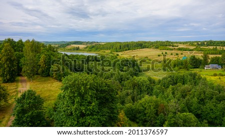 Field, forest and lake with a height