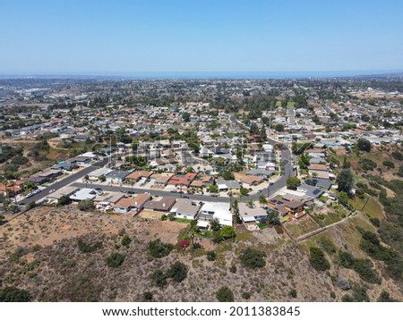 Aerial view of villas on the top of a valley and cliff with blue sky in San Diego County, California, USA