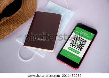 Vaccine passport, health vaccinated of covid-19 on app with mobile smart phone on desk, vaccination for immune with travel, certificate for safety of tourist, scan signing for smartphone for tourism.