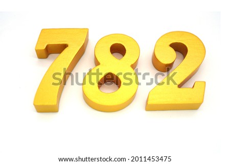 Arabic numerals 782 gold on white background                              