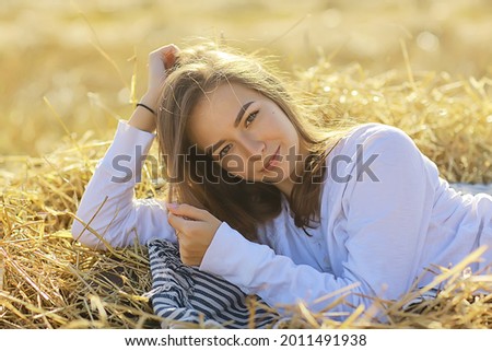 cheerful happy girl smiling in the summer in the field portrait, young girl happiness lifestyle