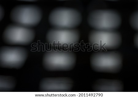 Black background with neat white light spots