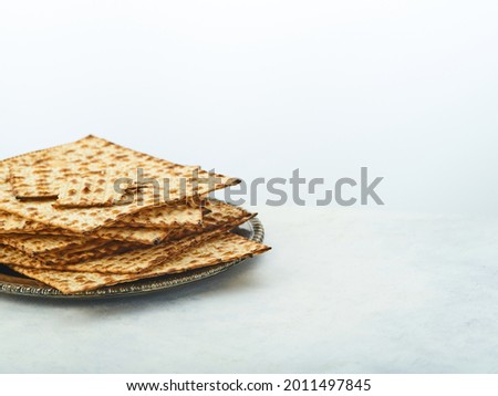Jewish Easter bread matzah. Jewish customs, traditions, celebration of the Jewish Passover. The main course for the Jewish Passover. Minimalism. There are no people in the photo.