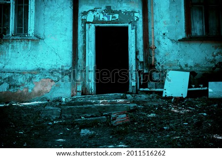 Scary grunge background in horror style, open door entrance to a dangerous staircase of an old crumbling house, steps and stairs to a mystical abandoned ruined dirty dark basement, a feeling of fear