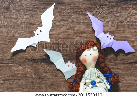 Several bats on a dark background.scary doll. Halloween concept.Copy space. Decor for halloween
