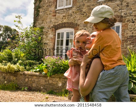A young mother of two children enjoys her summer holidays in a beautiful cottage in the UK