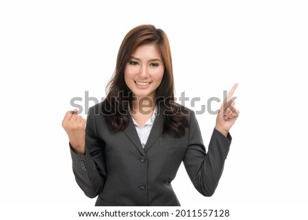 Happy young business Asian woman pointing and laughing with blank copy space,concept of human emotions and facial expression,portrait of beautiful Asian woman, isolated on white background