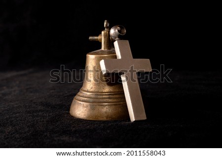 Religion and culture. Symbol of faith and hope, bell and cross. God is always with us.