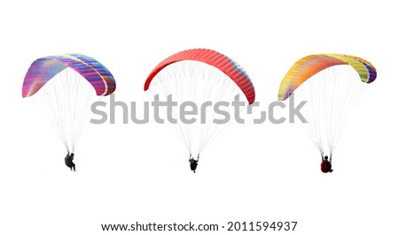 collection Bright colorful parachute isolated on white background,  The sportsman flying on a paraglider. Concept of extreme sport, taking adventure challenge. Royalty-Free Stock Photo #2011594937