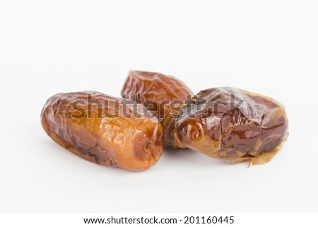 Dried date on gray background - Stock Image macro.