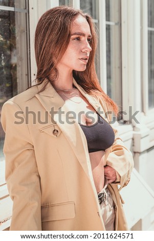 Outdoor portrait of young beautiful happy woman. Model posing outdoor.