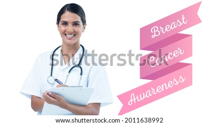 Composition of smiling female doctor with breast cancer text on white. breast cancer positive awareness campaign concept digitally generated image.